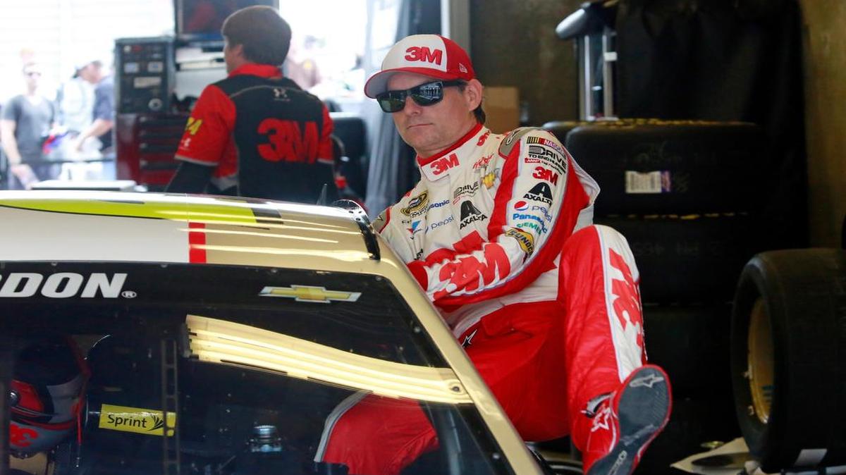 
Sprint Cup Series driver Jeff Gordon (24) climbs into his car during practice for the NASCAR Brickyard 400 auto race at Indianapolis Motor Speedway in Indianapolis, Friday, July 24, 2015. 
