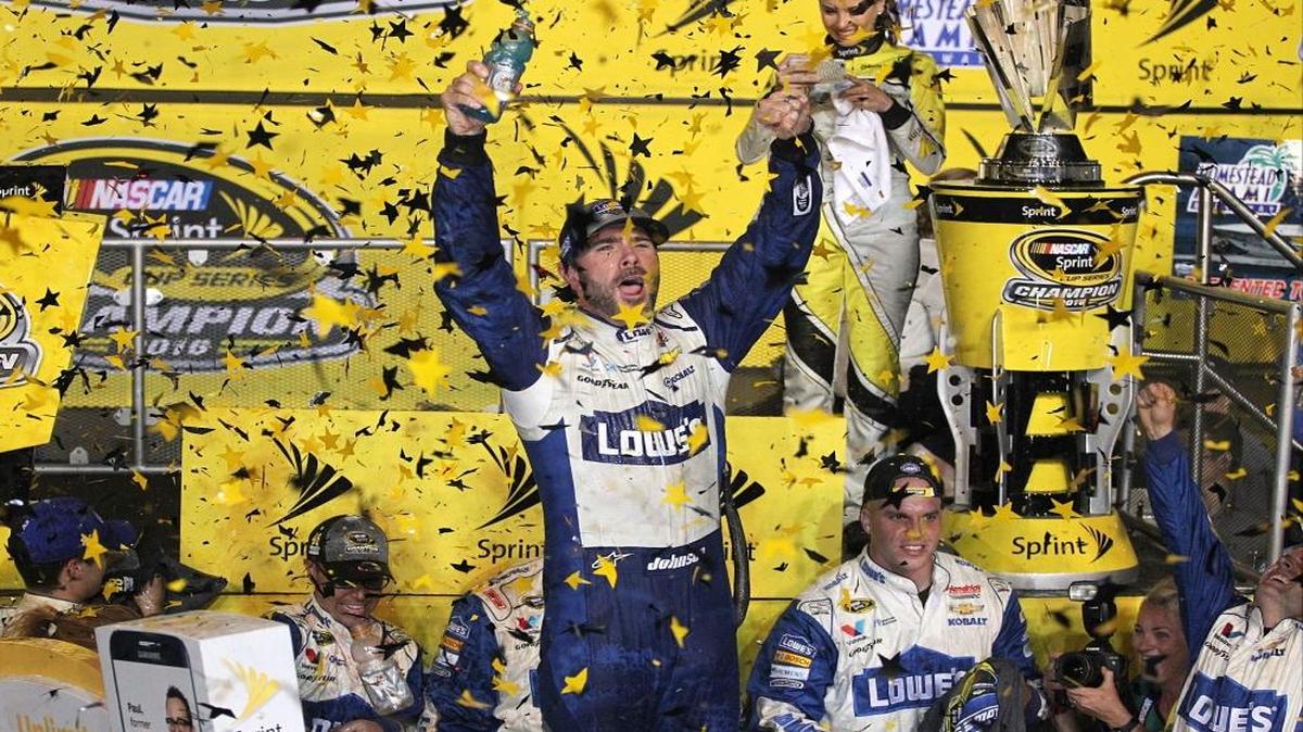 Jimmie Johnson, center, celebrated as confetti rains down after winning NASCAR Sprint Cup Championship and NASCAR Sprint Cup Series Ford EcoBoost 400 Championship at Homestead-Miami Speedway on Sun., Nov. 20, 2016.