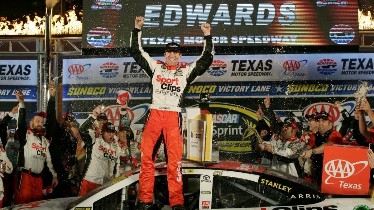 Carl Edwards celebrates in victory lane after winning the NASCAR Sprint Cup Series auto race at Texas Motor Speedway in Fort Worth, Texas, Sunday, Nov. 6, 2016.
