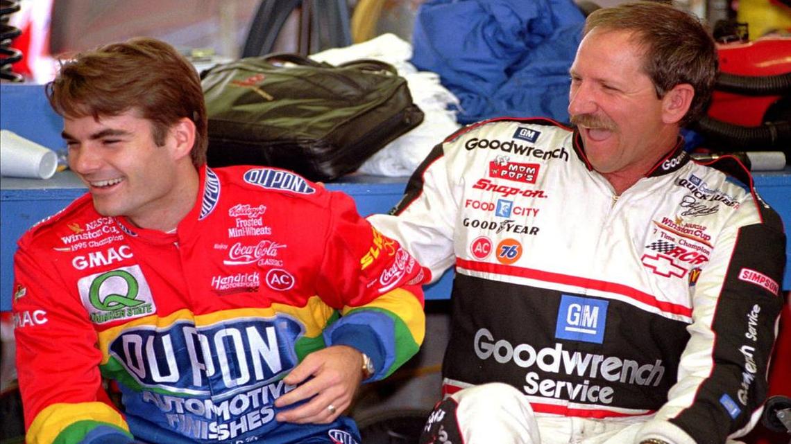 Jeff Gordon, left, and Dale Earnhardt enjoy a light moment during preparations for a 1996 race at the North Wilkesboro (N.C.) Speedway.