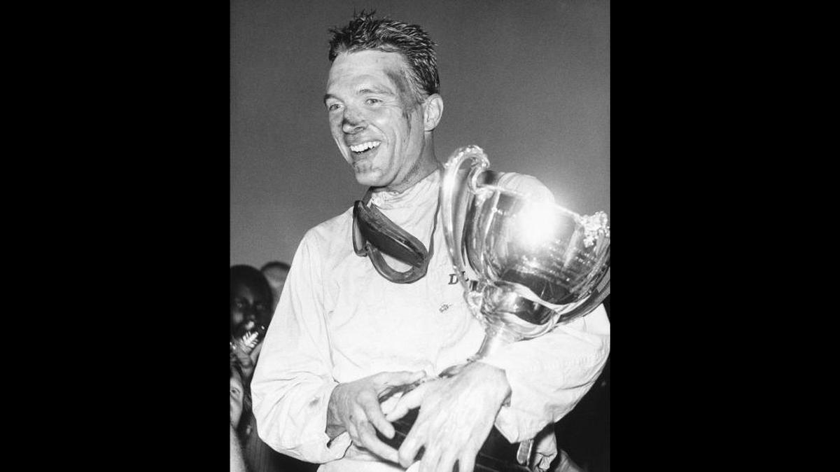 Dan Gurney after a 1962 race win in the Bahamas. Gurney died Sunday at age 86 of complications from pneumonia.