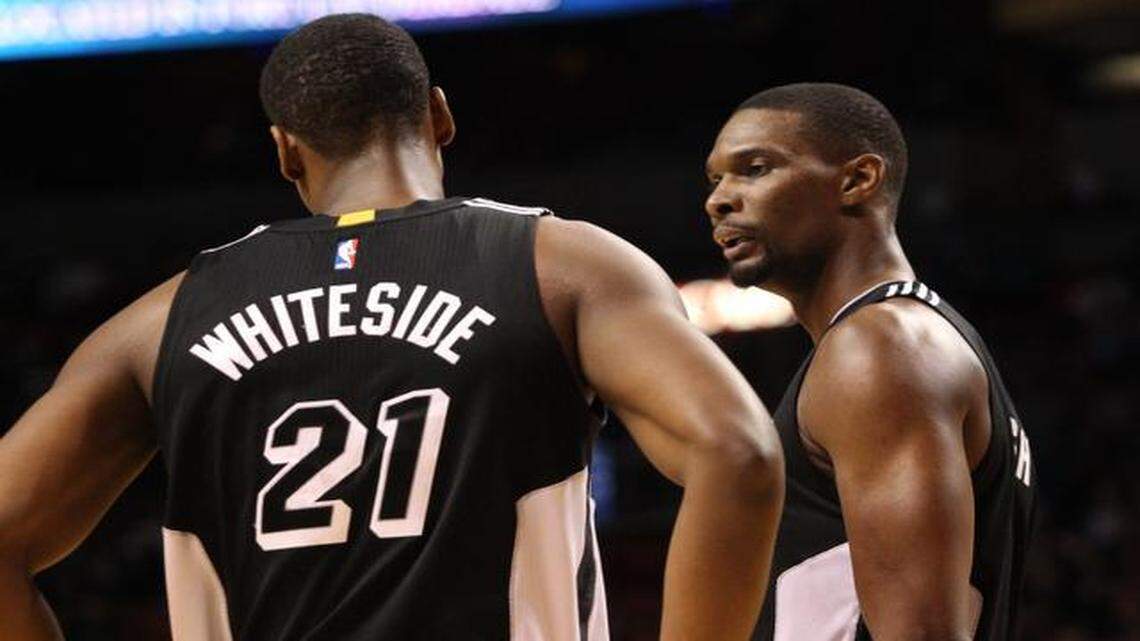 
Chris Bosh talks to Hassan Whiteside in the second quarter during the Miami Heat’s game against the Milwaukee Bucks at AmericanAirlines Arena on Tuesday, January 27, 2015.
