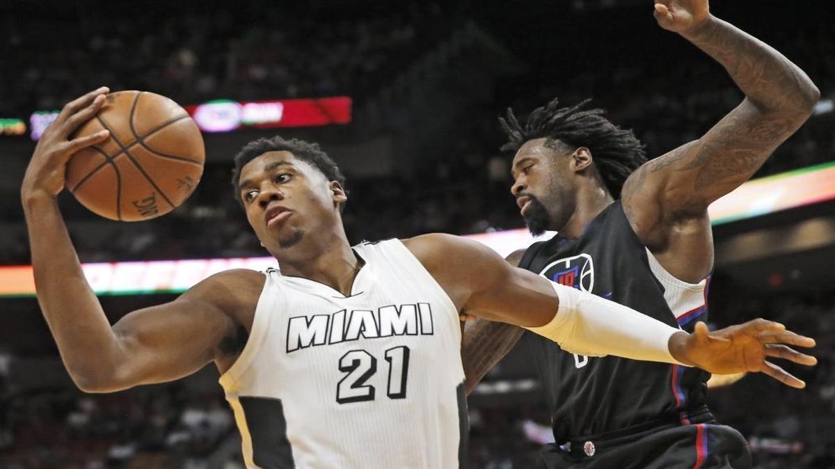 Miami Heat center Hassan Whiteside (21) rebounds in the third quarter as the Miami Heat host the Los Angeles Clippers at the AmericanAirlines Arena on Friday, Dec. 16, 2016.