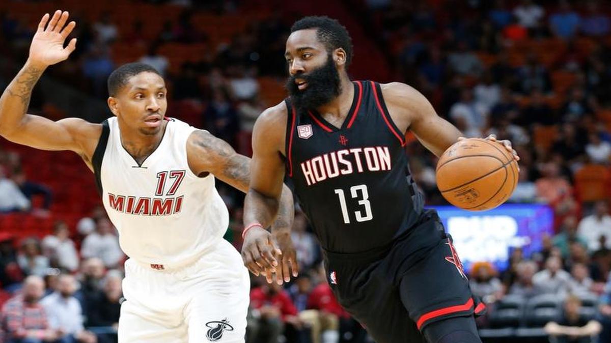 Houston Rockets guard James Harden (13) takes the ball down court against Miami Heat guard Rodney McGruder (17) during the first half of an NBA basketball game against the Miami Heat, Tues., Jan. 17, 2017, in Miami.