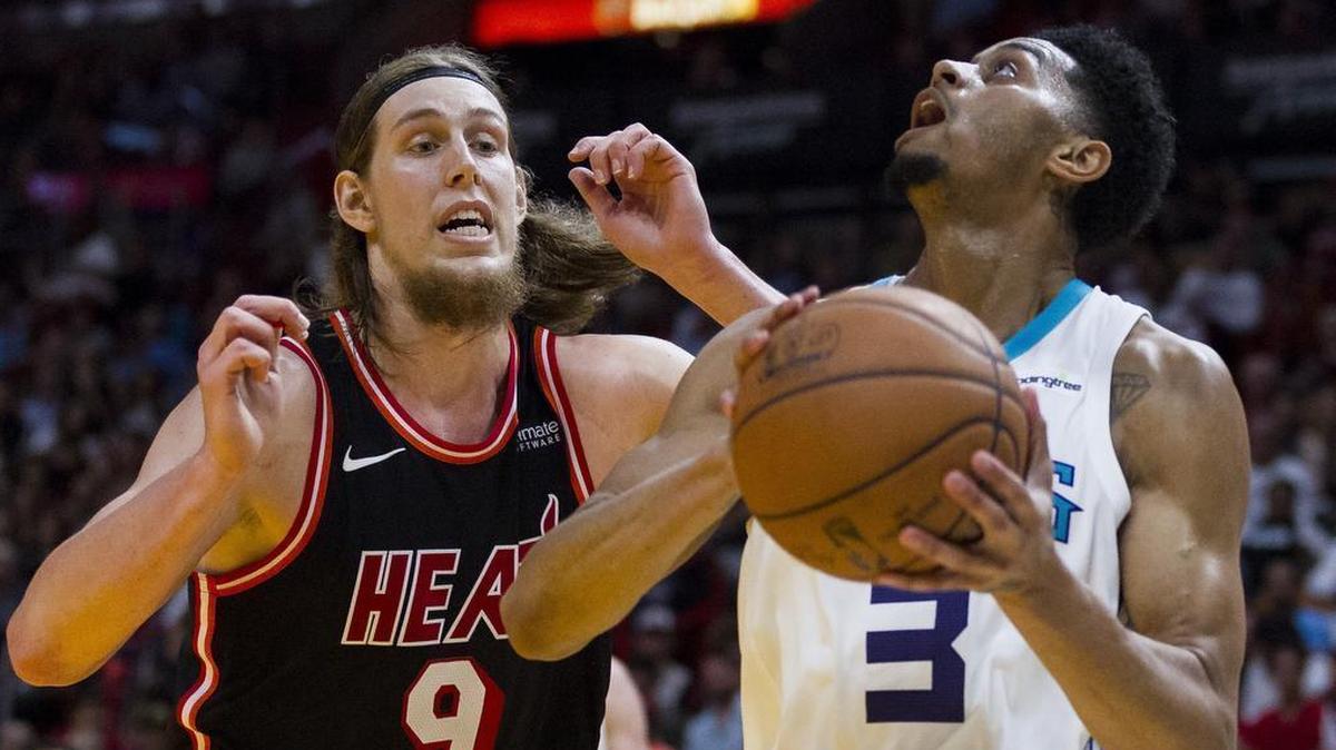 The Heat’s Kelly Olynyk tries to block Jeremy Lamb in the fourth quarter as Miami hosts the Charlotte Hornets at the AmericanAirlines Arena on Dec. 1, 2017. Olynyk will be honored Wednesday night by the Boston Celtics, his former team, with their Hero Among Us award, given to individuals who have made an overwhelming impact on the lives of others in the Boston community.