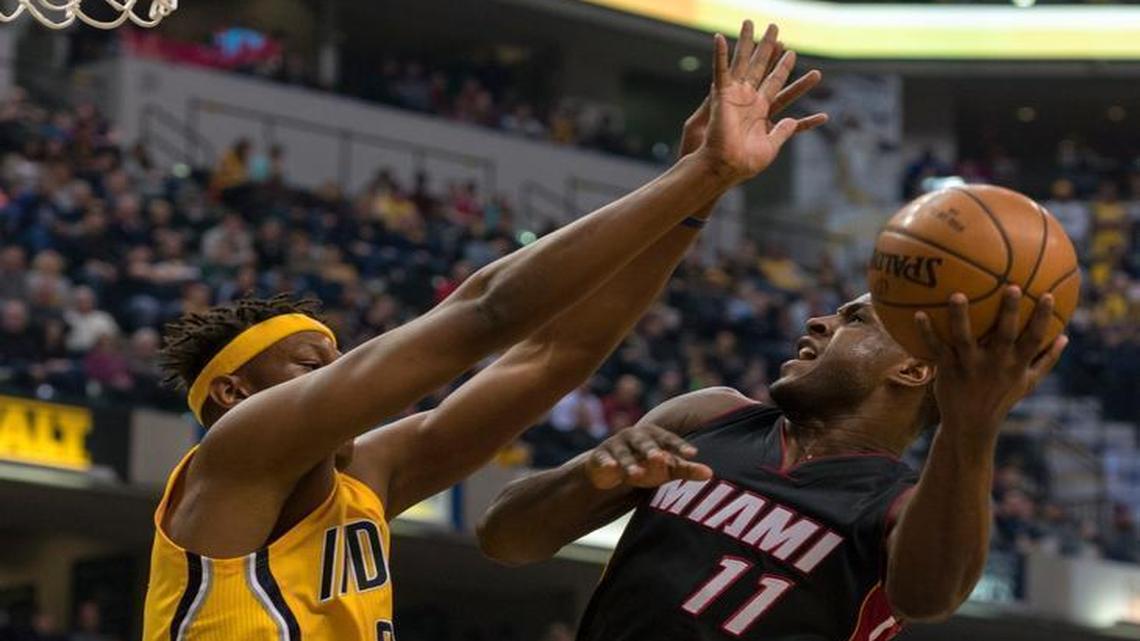 Miami Heat guard Dion Waiters (11) works to get his shot off as he's defended by Indiana Pacers center Myles Turner (33) during the first half of an NBA basketball game, Sunday, March 12, 2017, in Indianapolis.