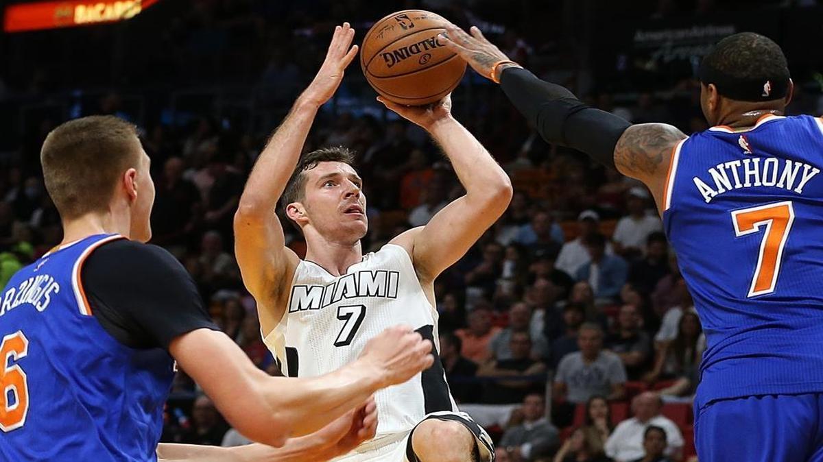 Miami Heat guard Goran Dragic goes to the basket against Knicks' Kristaps Porzingis (left) and Carmelo Anthony in the first quarter of the Miami Heat and New York Knicks game at AmericanAirlines Arena in Miami on Tues., Dec. 6, 2016.