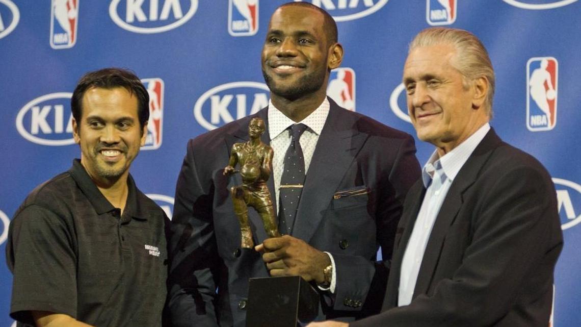 LeBron James, alongside Pat Riley (at right) and coach Erik Spoelstra, wins his 4th MVP trophy from the NBA at AmericanAirlines Arena on May 5, 2013.