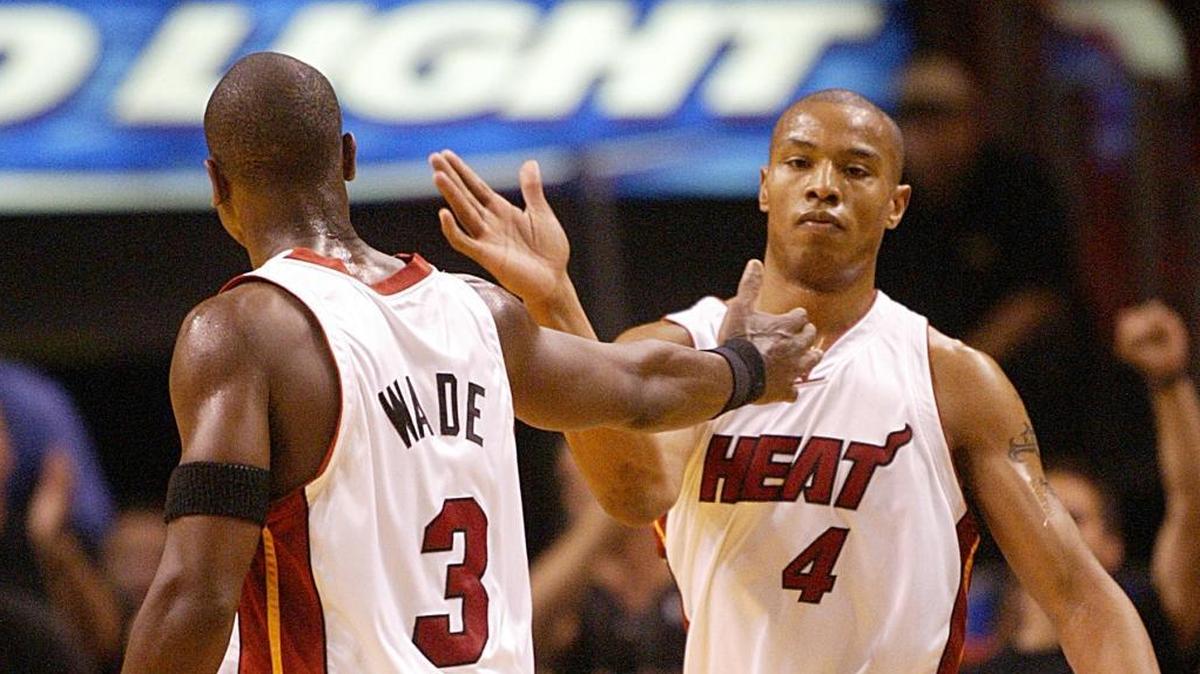 In this file photo, Dwyane Wade and Caron Butler celebrate afer Wade scores in the closing minutes of the fourth quarter and the Miami Heat beat the New Orleans Hornets in the first game of the 2004 NBA Playoffs.