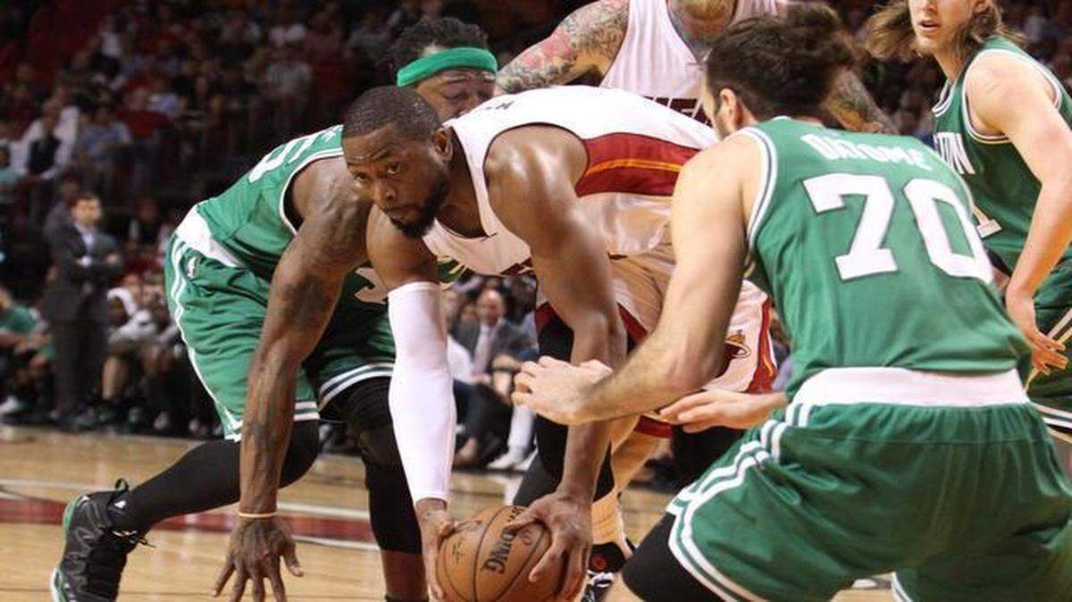 
Dwyane Wade recovers a loose ball in the fourth quarter during the Miami Heat’s game against the Boston Celtics at AmericanAirlines Arena on Monday, March 9, 2015.
