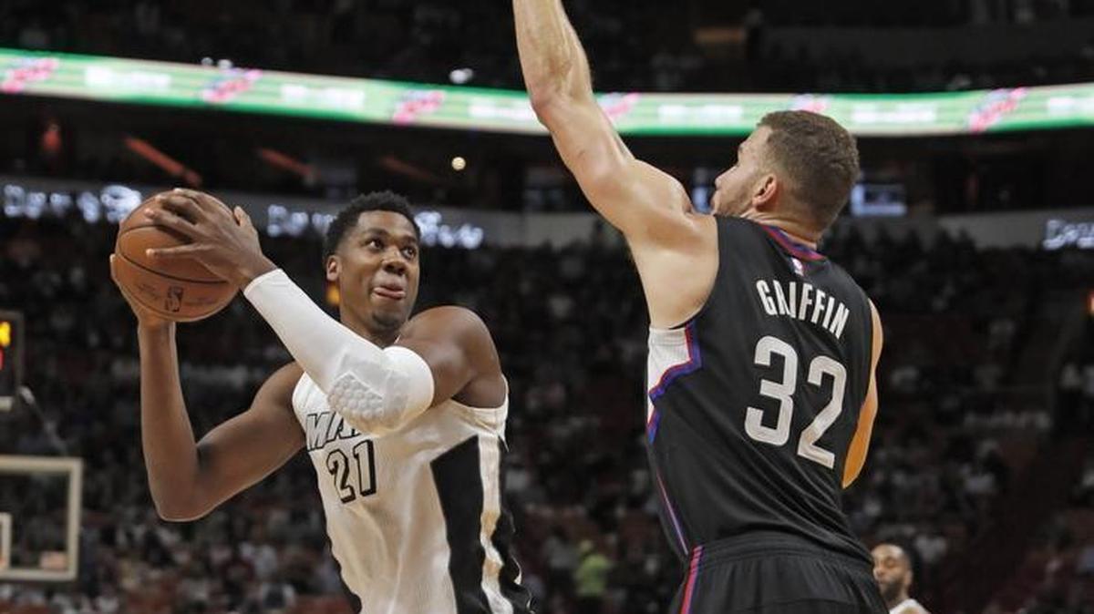 Miami Heat center Hassan Whiteside goes up for a basket against L.A. Clippers forward Blake Griffin in the first quarter at AmericanAirlines Arena on Friday, December 16, 2016.