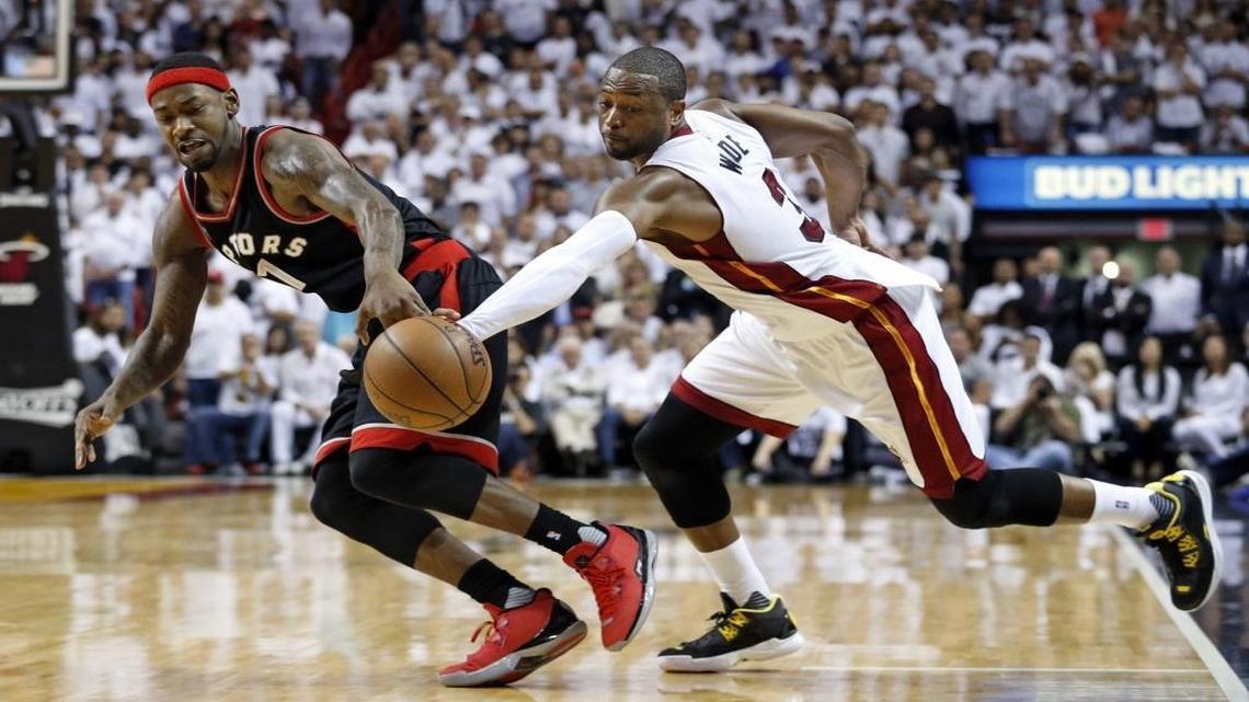 Miami Heat guard Dwyane Wade, right, steals the ball from Toronto Raptors forward Terrence Ross in the final seconds of overtime during Game 4 of the Heat-Raptors NBA Playoff series at AmericanAirlines Arena on Mon., May 9, 2016.