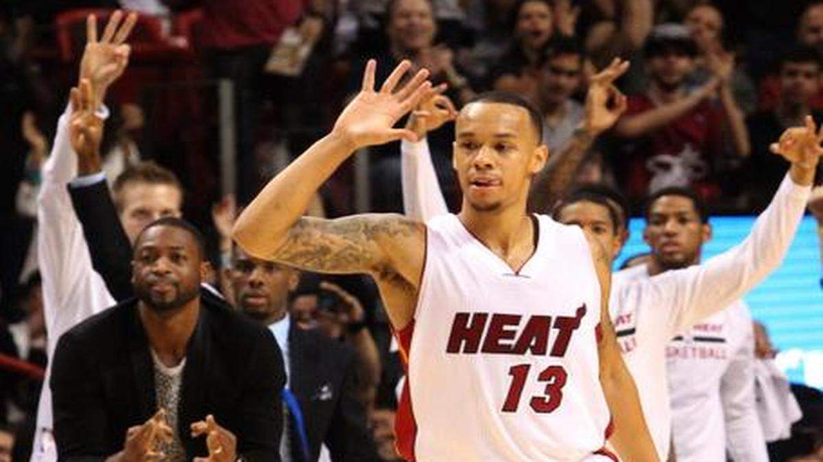 
Miami Heat point guard Shabazz Napier reacts after hitting a three-pointer in the fourth quarter against the Charlotte Hornets at AmericanAirlines Arena on Sunday, Nov. 23, 2014.
