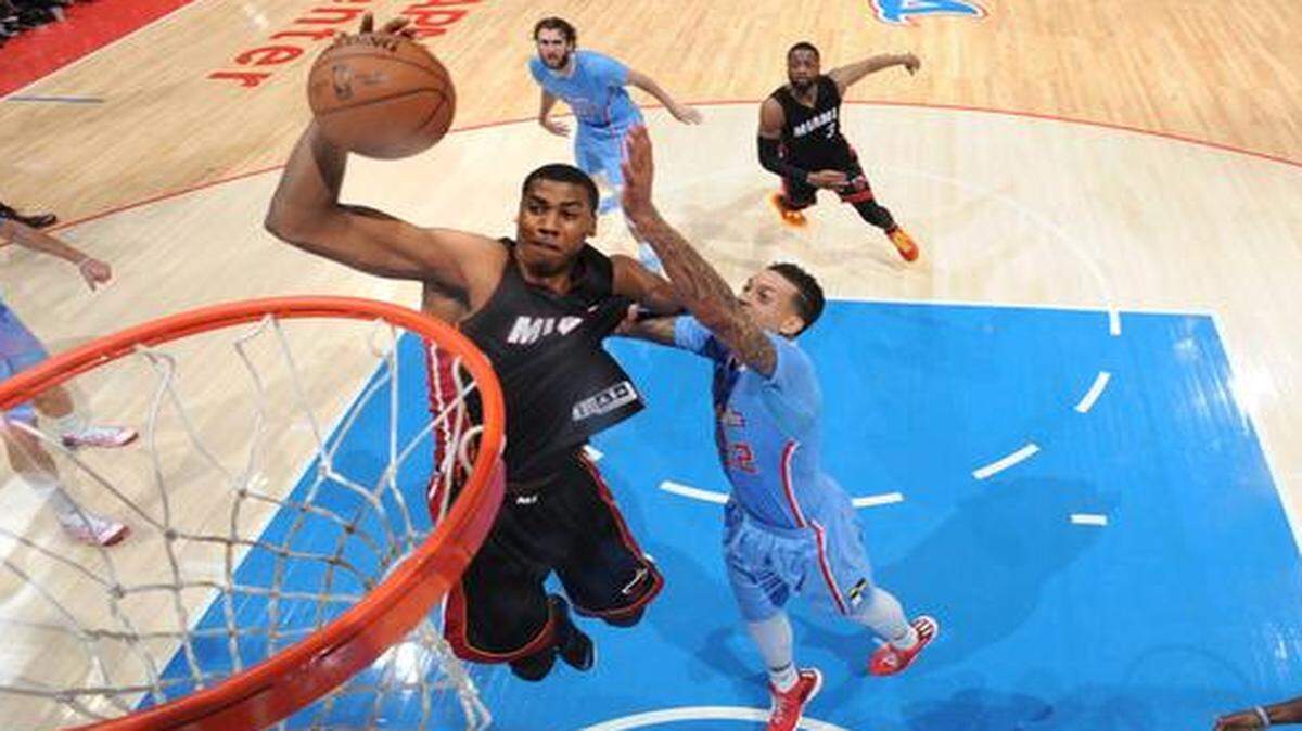 
 Hassan Whiteside #21 of the Miami Heat goes for the dunk against the Los Angeles Clippers during the game on January 11, 2015 at STAPLES CENTER in Los Angeles, California . 
