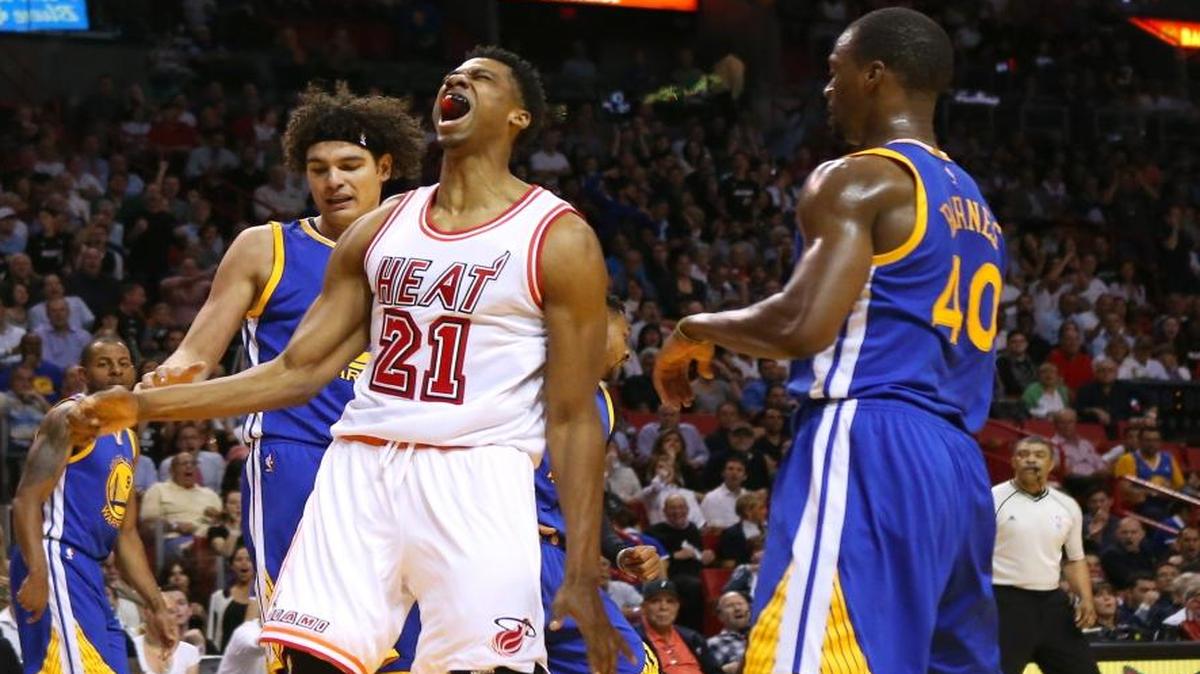 Hassan Whiteside of the Miami Heat reacts after dunking against the Golden State Warriors at AmericanAirlines Arena in Miami on Wednesday, February 24, 2016.