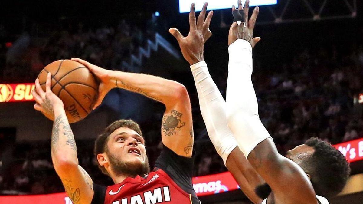 Miami Heat’s Tyler Johnson shoots over Denver Nuggets’ Paul Millsap hands in the first quarter Monday, March 19, 2018, at the AmericanAirlines Arena in Miami.