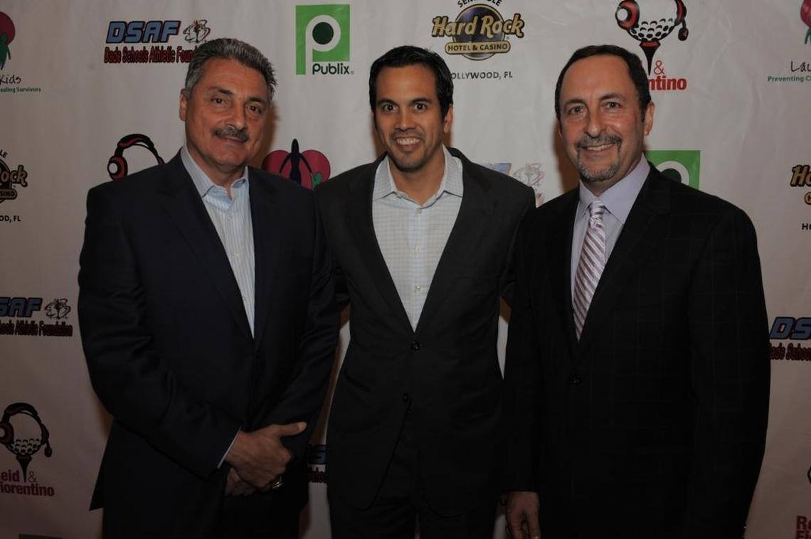 Miami Heat color commentator Tony Fiorentino, coach Erik Spoelstra and play-by-play man Eric Reid pose for a photo at a charity event in 2010.