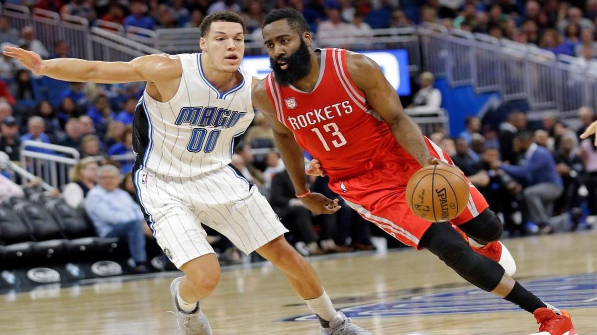 Houston Rockets' James Harden (13) drives around Orlando Magic's Aaron Gordon (00) during the first half of an NBA basketball game, Fri., Jan. 6, 2017, in Orlando, Fla.