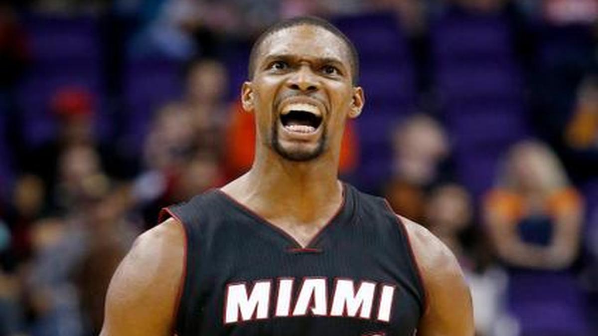 
Miami Heat's Chris Bosh celebrates after hitting a 3-pointer against the Phoenix Suns during the second half of an NBA basketball game Tuesday, Dec. 9, 2014, in Phoenix. The Heat won 103-97. 
