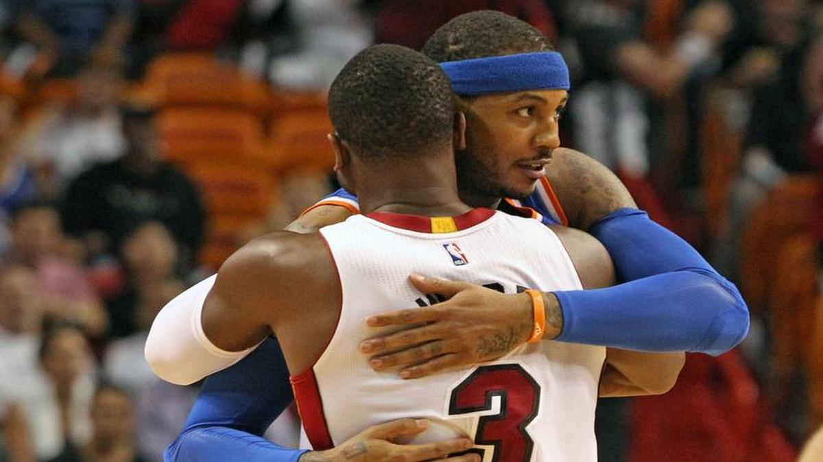 The Heat’s Dwyane Wade and the Knicks’Carmelo Anthony hug before the game at AmericanAirlines Arena.