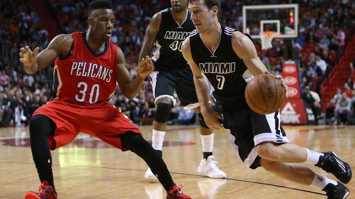 
Miami Heat guard Goran Dragic drives against New Orleans Pelicans guard Norris Cole during the first quarter at AmericanAirlines Arena in Miami on Saturday, Feb. 21, 2015.
