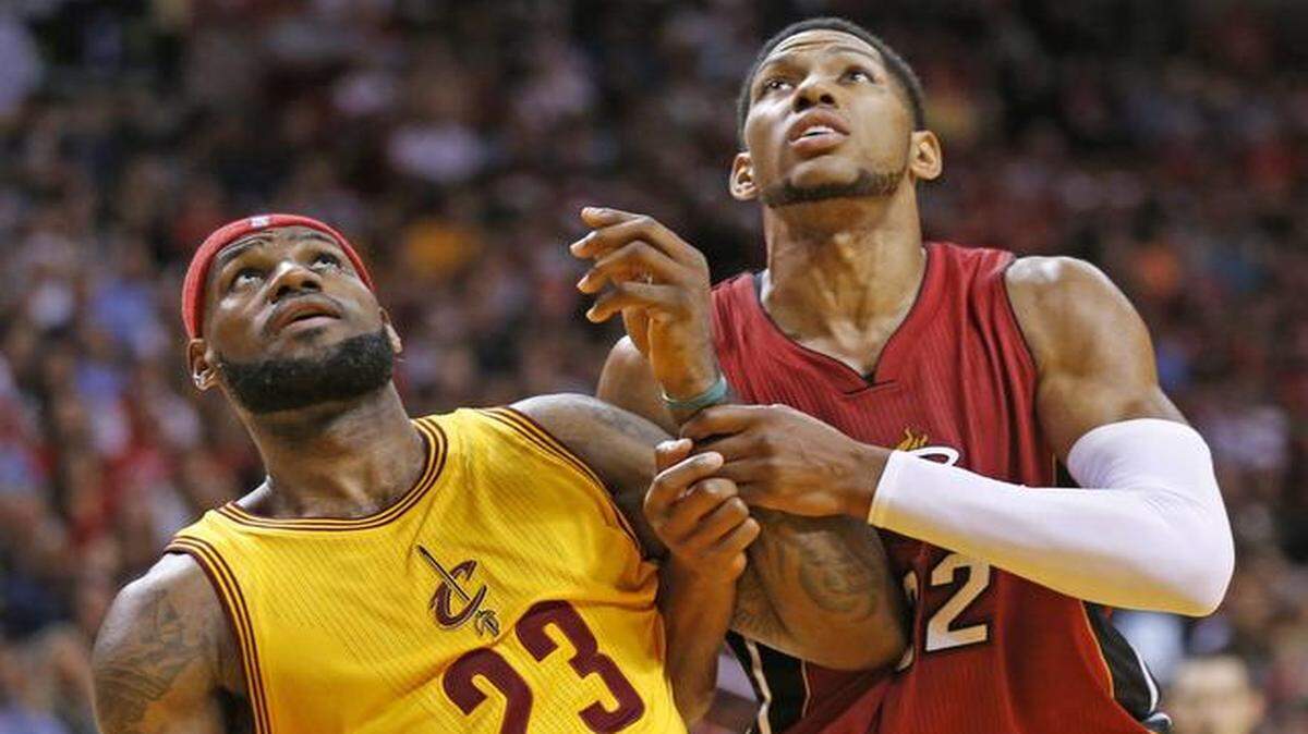 
Cleveland Cavaliers forward LeBron James (23) and Miami Heat forward Danny Granger (22) battle for position in the fourth quarter of their game at AmericanAirlines Arena in Miami on Dec. 25, 2014.
