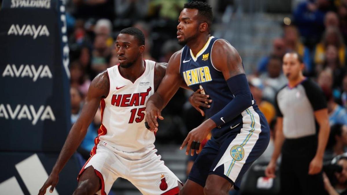 Miami Heat forward Okaro White (15) and Denver Nuggets forward Paul Millsap (4) in the first half of an NBA basketball game Fri., Nov. 3, 2017, in Denver.