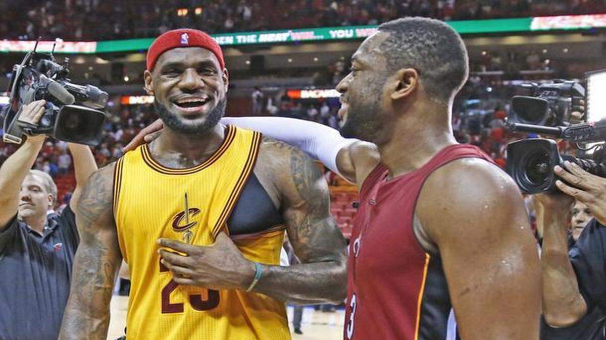 
LeBron James and Dwyane Wade share a laugh as the Miami Heat host the Cleveland Cavaliers at the AmericanAirlines Arena on Thursday, December 25, 2014.
