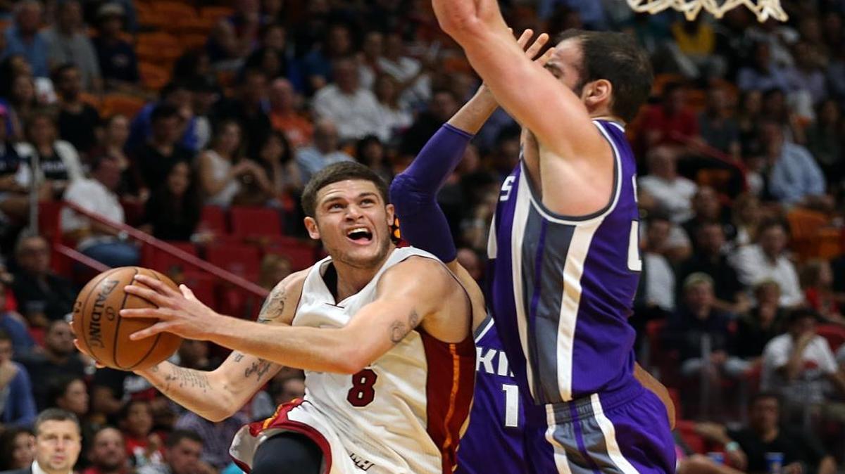 Miami Heat's guard Tyler Johnson goes to the basket against Kings' center Kosta Koufos, 41, in the third quarter of the Miami Heat and Sacramento Kings game at AmericanAirlines Arena in Miami on Tues., Nov. 1, 2016.