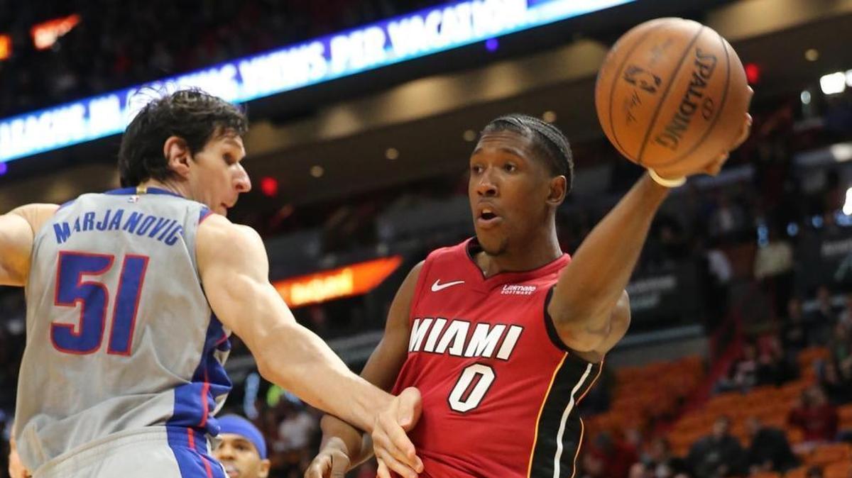 The Miami Heat’s Josh Richardson (0) throws the ball around the Detroit Pistons’ Boban Marjanovic (51) in the first quarter at AmericanAirlines Arena in Miami on Wednesday, Jan. 3, 2018.