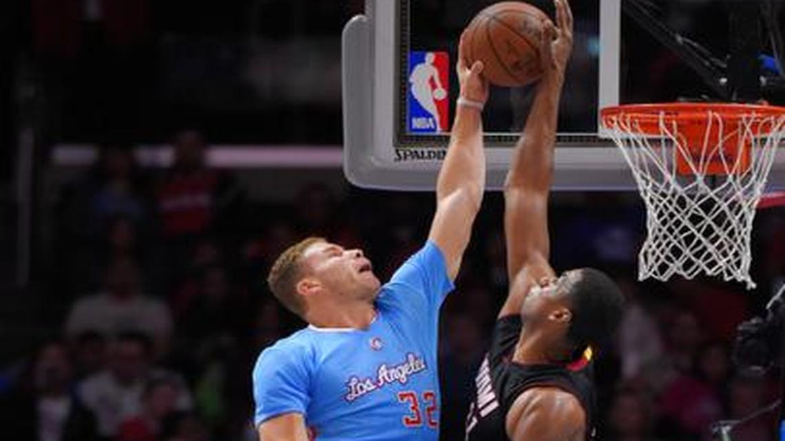 
Los Angeles Clippers forward Blake Griffin, left, has his shot blocked by Miami Heat center Hassan Whiteside during the second half of an NBA basketball game, Sunday, Jan. 11, 2015, in Los Angeles. The Heat won 104-90. 

