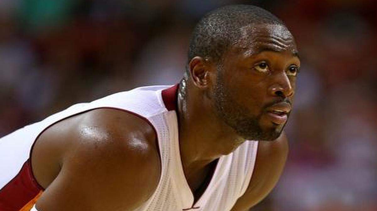 
Dwyane Wade #3 of the Miami Heat looks on during a preseason game against the Houston Rockets at American Airlines Arena on October 21, 2014 in Miami, Florida. 
