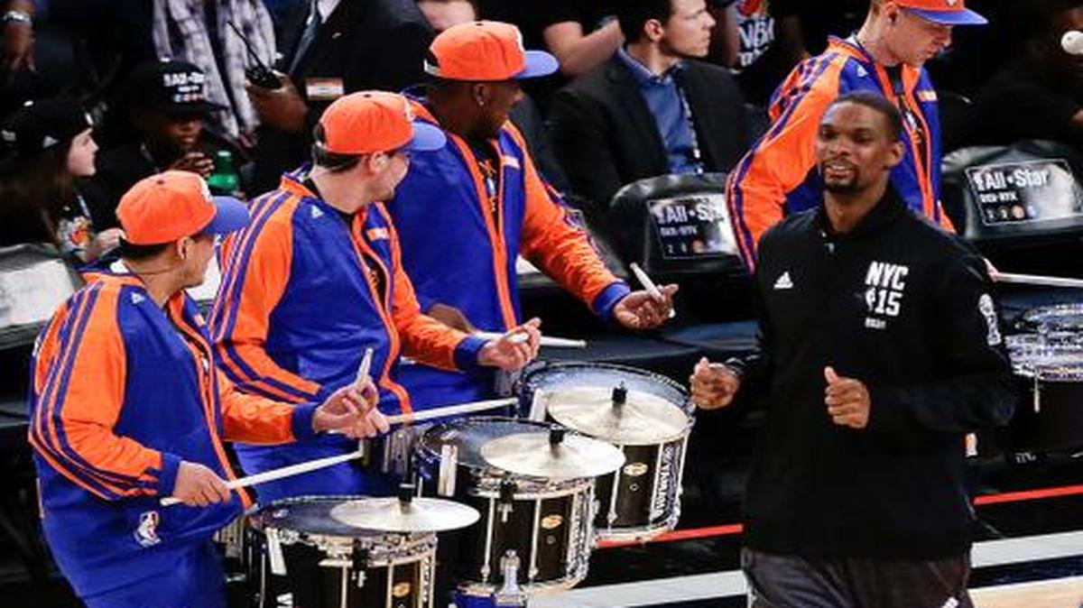 
East Team’s Chris Bosh, of the Miami Heat, arrives on the court with the East Team before the NBA All-Star basketball game Sunday, Feb. 15, 2015, in New York. 
