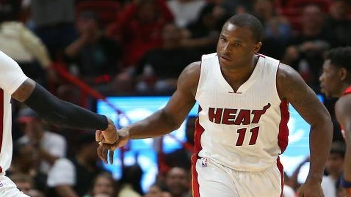 Miami Heat guard Dion Waiters is congratulated by forward James Johnson (16) after hitting a three pointer during the fourth quarter of an NBA basketball game against the New Orleans Pelicans at AmericanAirlines Arena in Miami on Wednesday, March 15, 2017.
