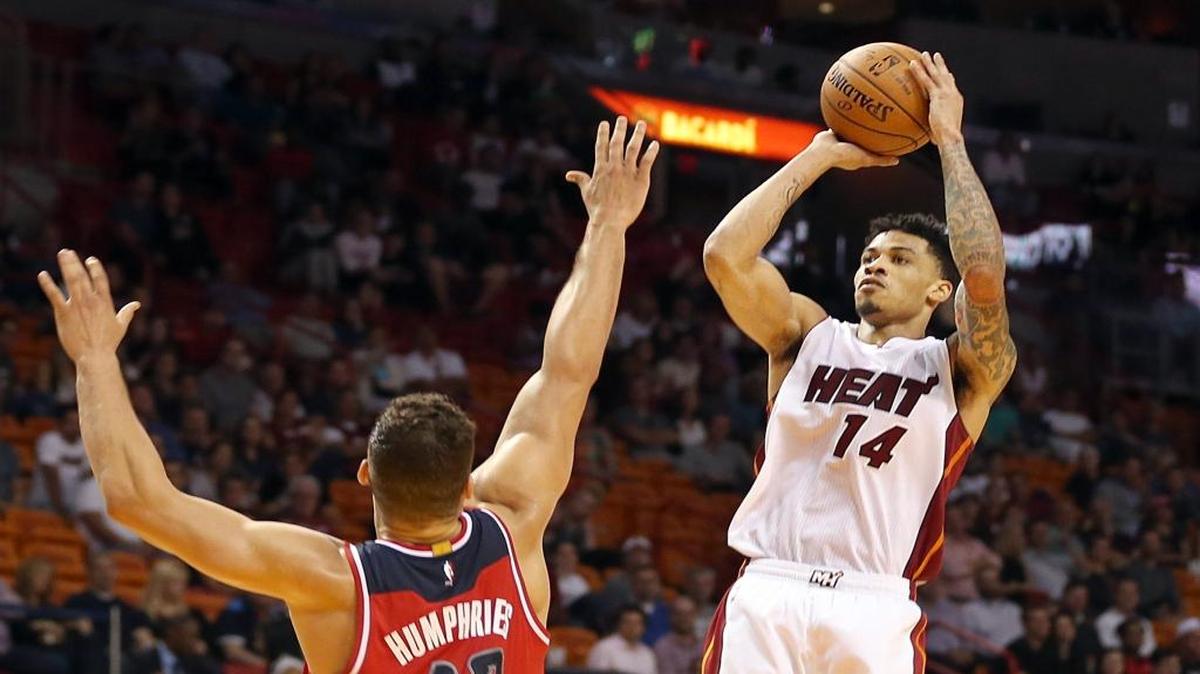 Miami Heat Gerald Green, shoots a three pointer over Wizards' Kris Humphries, in the fourth quarter of the Miami Heat vs Washington Wizards, NBA preseason game #7, at AmericanAirlines Arena in Miami on Wednesday, October 21, 2015.