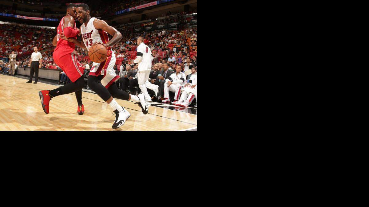 
Shawne Williams of the Miami Heat handles the ball against the Houston Rockets on Oct. 21, 2014 at AmericaAirlines Arena in Miami, Florida. 
