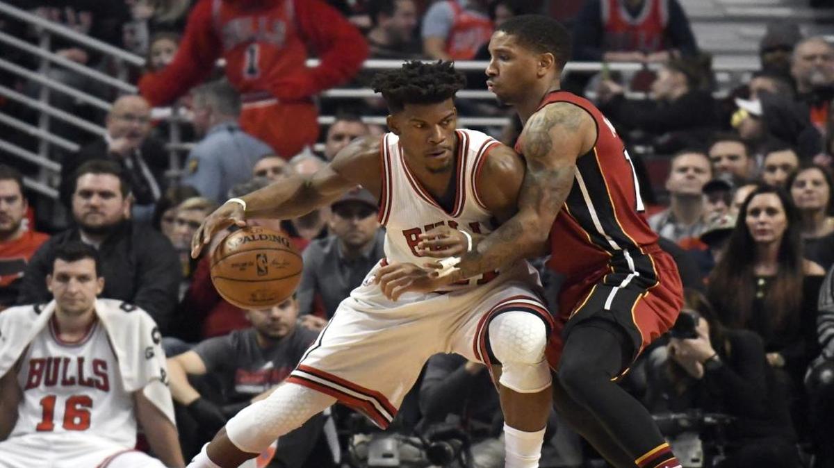 Chicago Bulls forward Jimmy Butler, left, works against Miami Heat guard Rodney McGruder during the first half of an NBA basketball game in Chicago, Friday, Jan. 27, 2017.