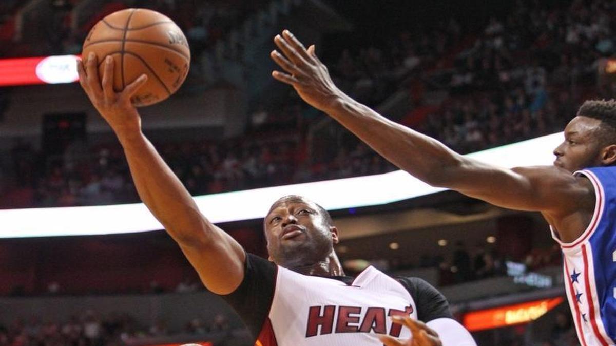Dwyane Wade goes up against Jerami Gran in the first quarter of the Miami Heat’s game against the Philadelphia 76ers on Sunday, March 6, 2016 at AmericanAirlines Arena in Miami.