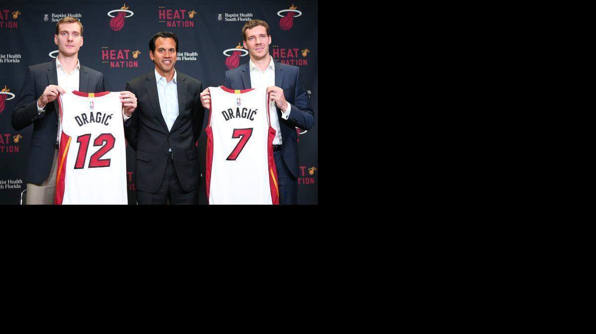 
Miami Heat head coach Erik Spoelstra poses with Goran Dragic,7, right, and his brother Zoran Dragic,12, left, during a news conference at the AmericanAirlines Arena in Miami, Saturday, Feb. 21, 2015.
