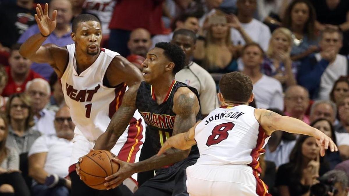Chris Bosh, left, and Tyler Johnson of the Miami Heat defend Atlanta Hawks guard Jeff Teague in the fourth quarter at AmericanAirlines Arena in Miami on Tuesday, Nov. 3, 2015.