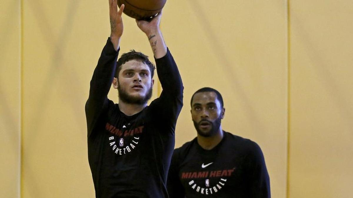 Miami Heat guard Tyler Johnson and teammate Wayne Ellington take shots during practice at the AmericanAirlines Arena in Miami on Wednesday, Feb. 21, 2018, in preparation for a regular season game against the New Orleans Pelicans.