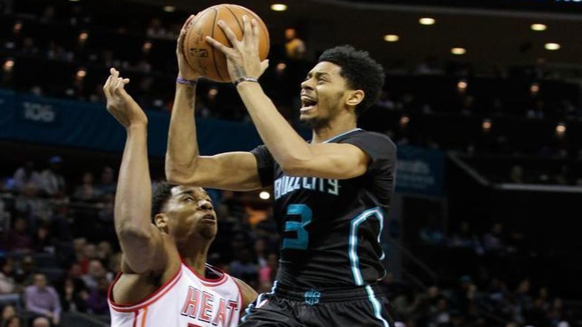 Charlotte Hornets guard Jeremy Lamb, right, drives to the basket against Miami Heat center Hassan Whiteside in the first half Friday, Feb. 5, 2016, in Charlotte, N.C.