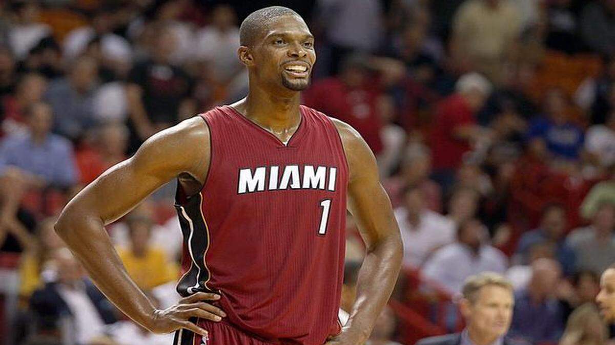 
Chris Bosh reacts in the fourth quarter of the Miami Heat's game against the Golden State Warriors at AmericanAirlines Arena in Miami on Tuesday, Nov. 25, 2014.
