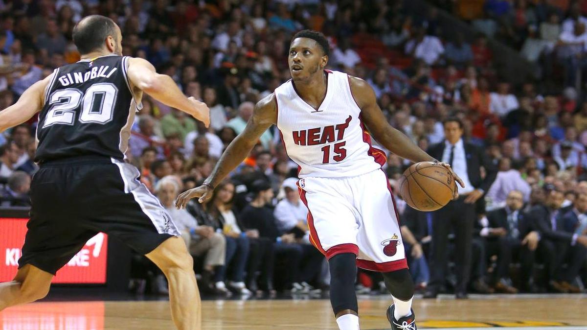 
Miami Heat guard Mario Chalmers drives against San Antonio Spurs guard Manu Ginobili during the first quarter of an NBA basketball game at the AmericanAirlines Arena in Miami on March 31, 2015.
