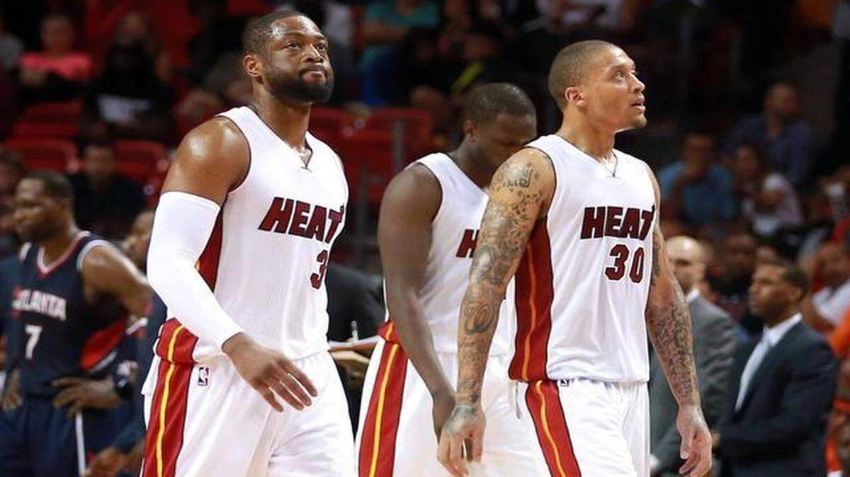 
Dwyane Wade, Luol Deng and Michael Beasley react in the fourth quarter of the Miami Heat’s game against the Atlanta Hawks at AmericanAirlines Arena in Miami on Saturday, February 28, 2015.
