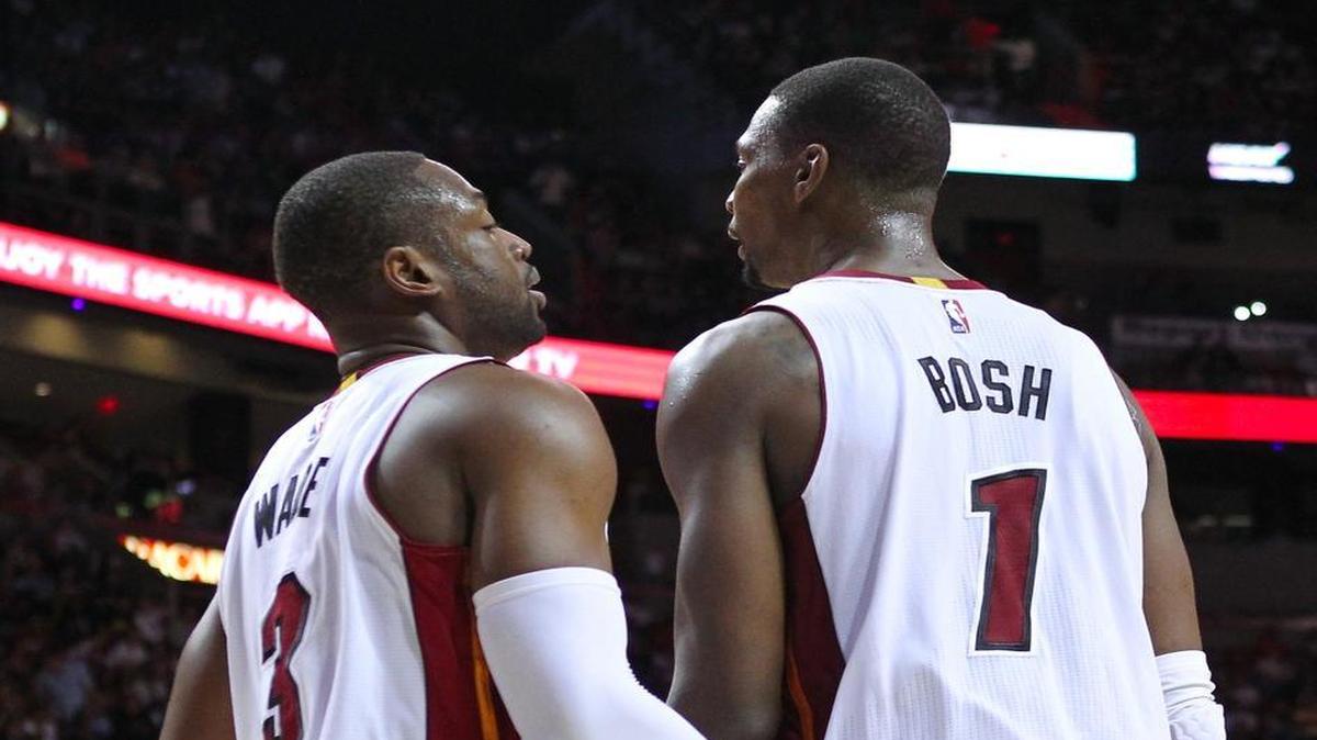 Miami Heat guard Dwyane Wade is congratulated by teammate Chris Bosh after play against the Minnesota Timberwolves during the second quarter of an NBA basketball game at the AmericanAirlines Arena in Miami on Saturday, November 8, 2014.
