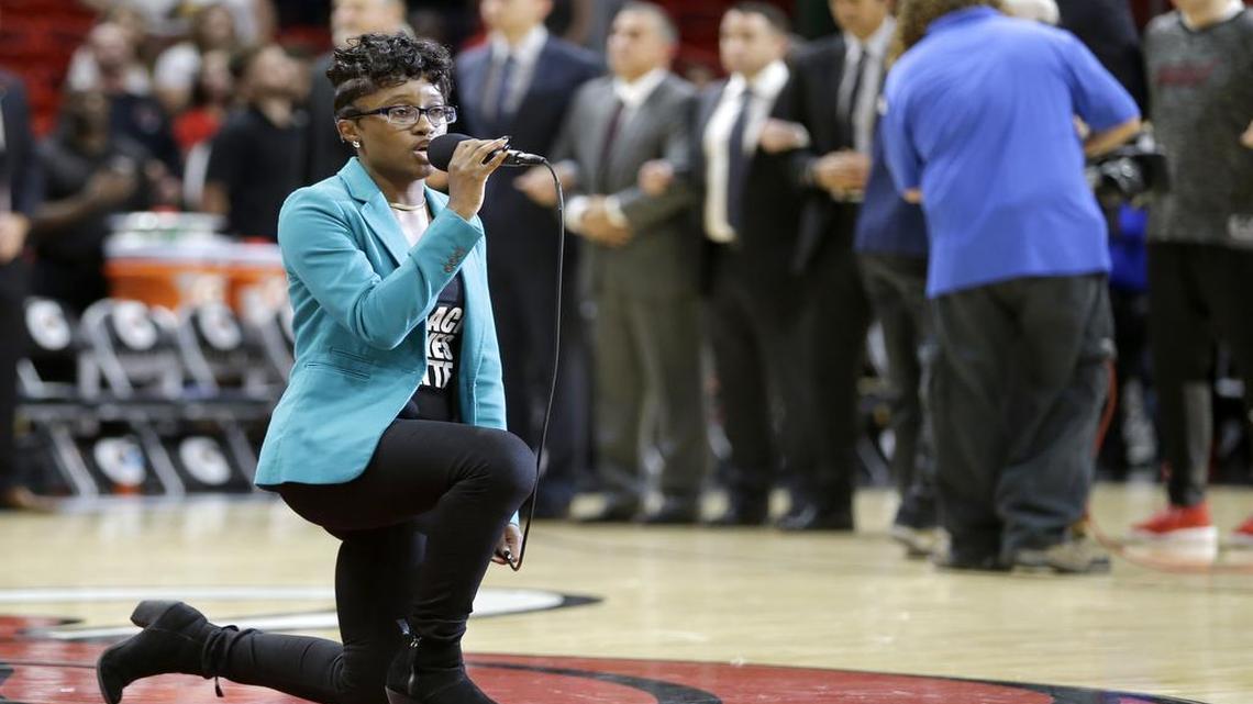 Denasia Lawrence sings the national anthem before an NBA preseason basketball game between the Miami Heat and the Philadelphia 76ers on Oct. 21, 2016, in Miami.