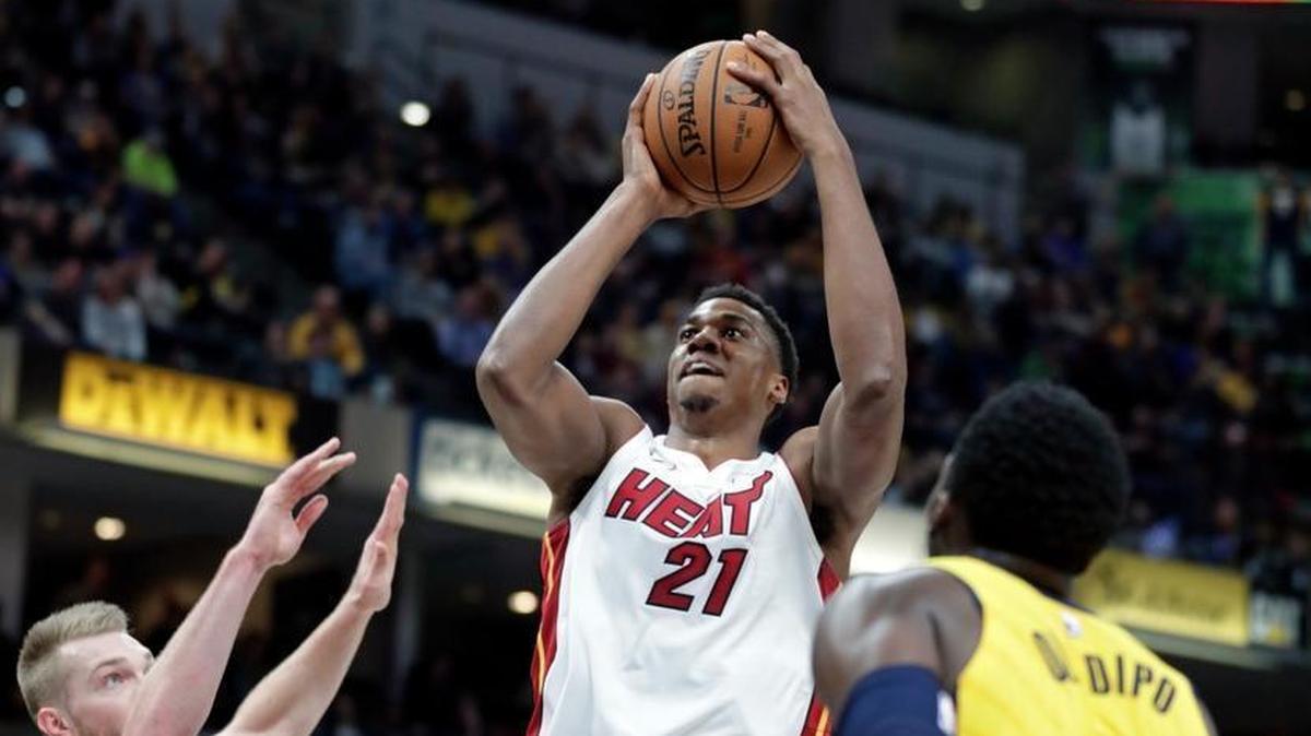 Miami Heat center Hassan Whiteside shoots over Indiana Pacers center Domantas Sabonis, left, and guard Victor Oladipo during the first half in Indianapolis, Wednesday, Jan. 10, 2018.