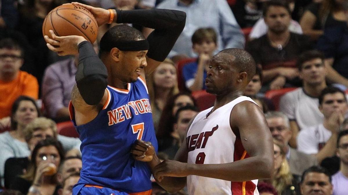 Knicks forward Carmelo Anthony, who finished with 25 points, is heavy guarded by Loul Deng of the Miami Heat in the second quarter Wednesday, January 6, 2016 at AmericanAirlines Arena in Miami.