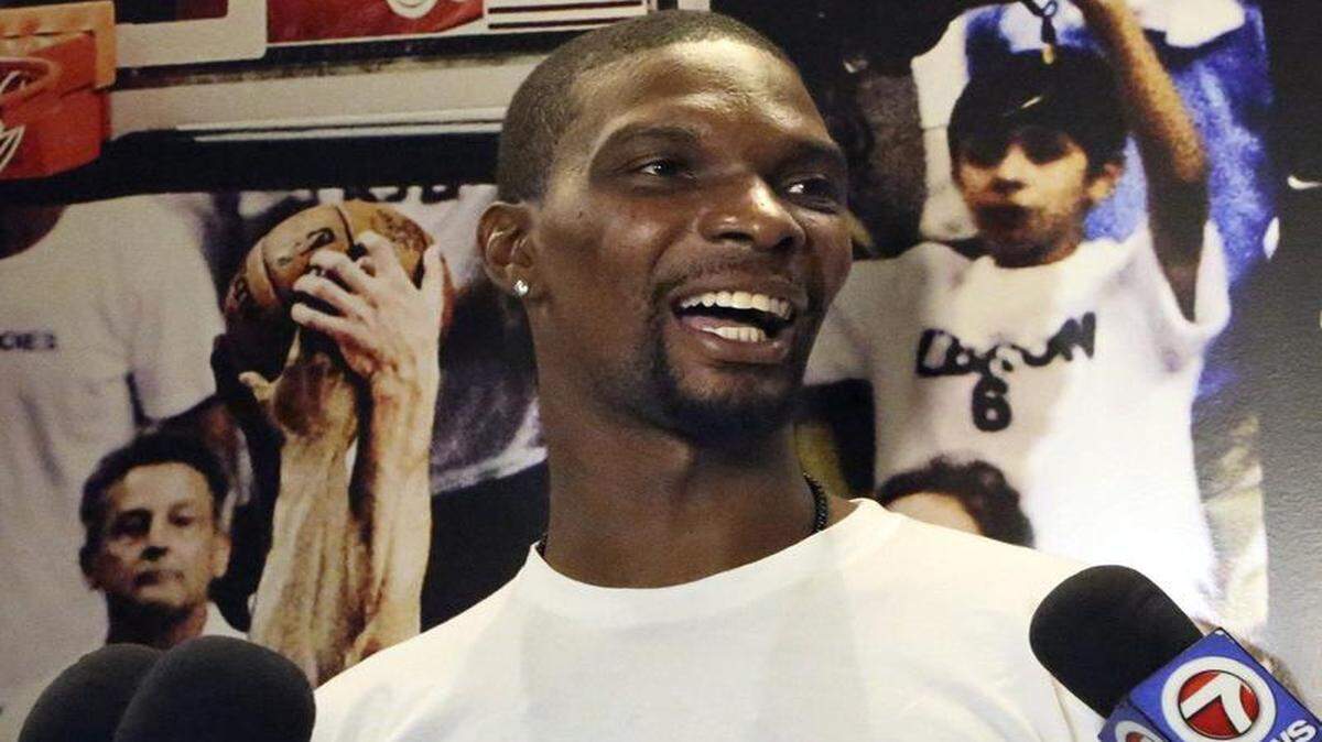 
Miami Heat forward Chris Bosh is upbeat as he talks to the media Friday, April 17, 2015 at AmericanAirlines Arena in Miami. With the team failing to make the playoffs, players cleared out their lockers Friday. 
